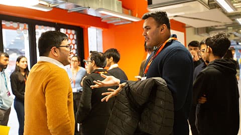 two people having a conversation one gestures with open hands