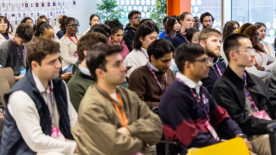 Students sat listening at an event