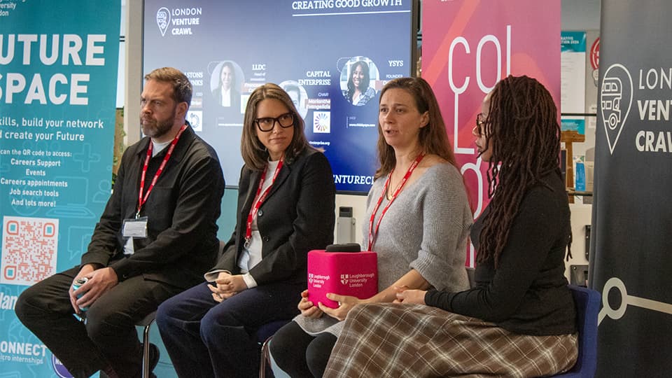 4 panellists speaking to an audience