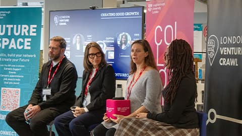 4 panellists speaking to an audience