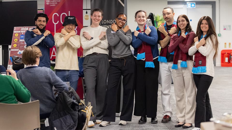 Photo of students crossing their arms and smiling at the camera