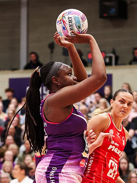 Loughborough Lightning athlete holding a netball