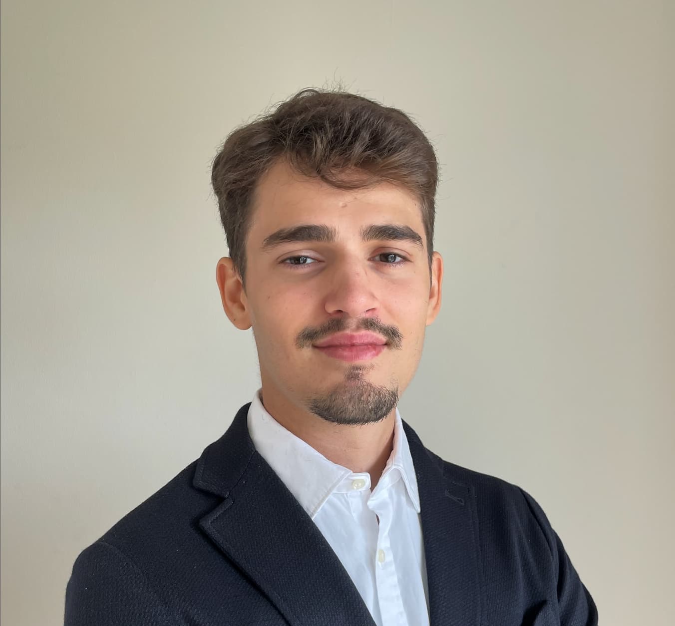 Cassian head shot photo plain background